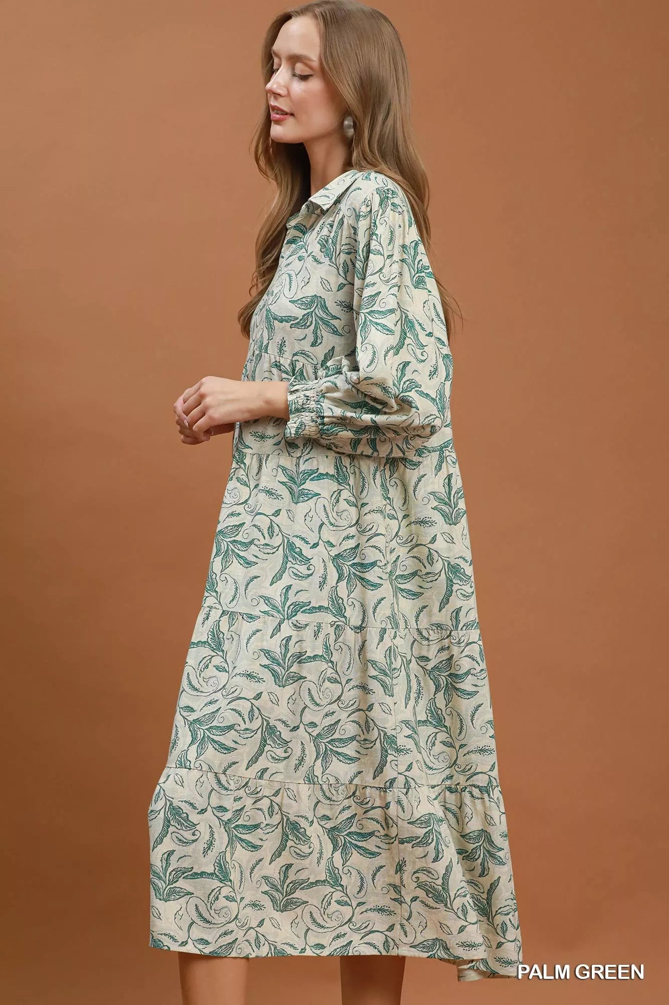 Palm green Umgee linen botanical print tiered midi dress with flowy silhouette and tiered design, perfect for casual or outdoor wear.