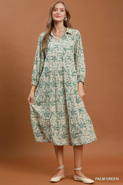 Palm green linen midi dress by Umgee with botanical print and tiered design, featuring a relaxed, flowy silhouette.