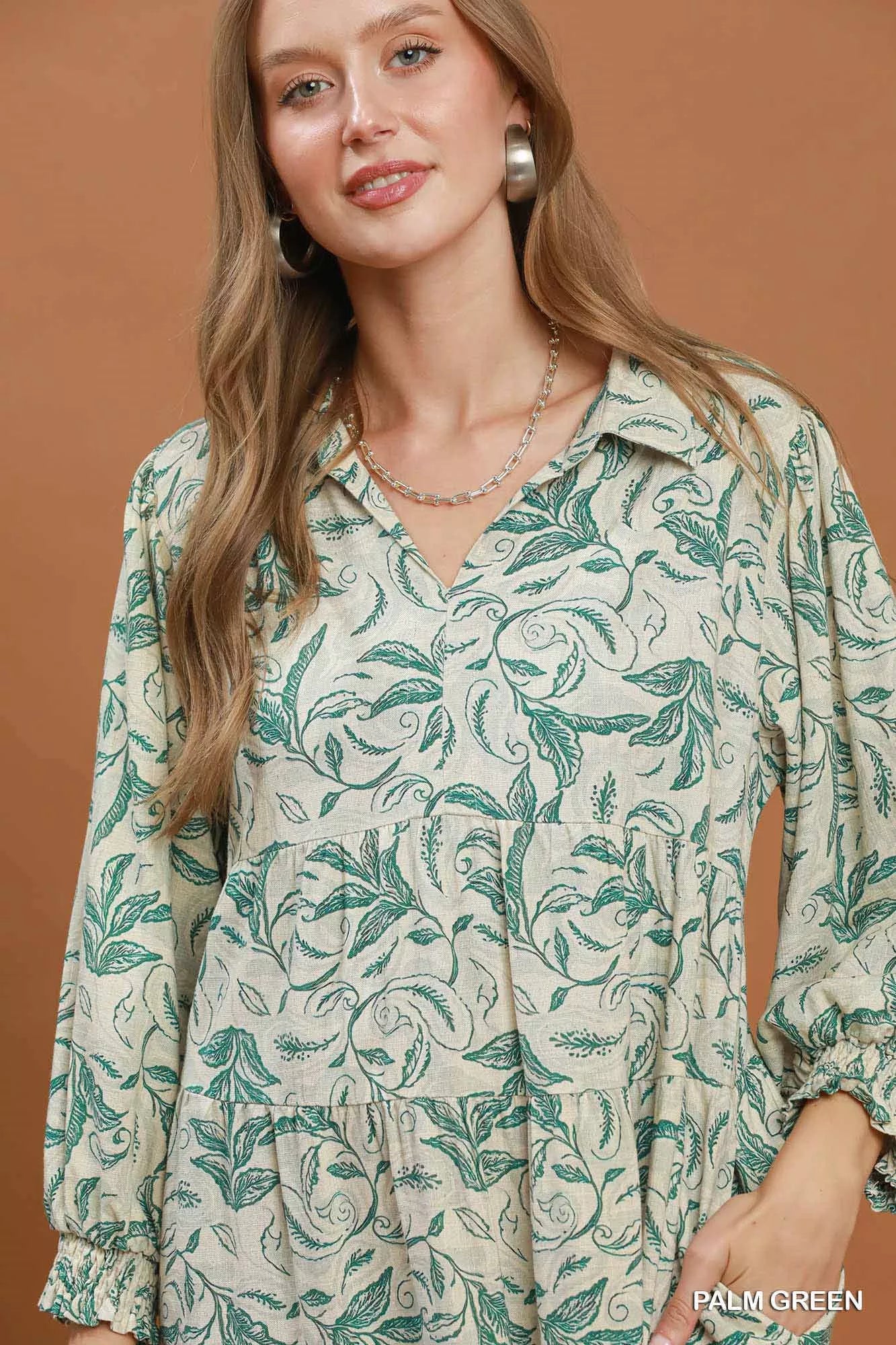 Trendsi Umgee linen botanical print tiered midi dress in palm green, featuring a flowy silhouette and tiered design.