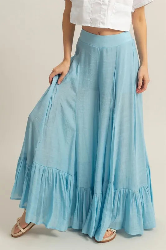 Pastel blue HYFVE high-waist ruffle flared wide-leg pants with flowy ruffle details, designed by Trendsi.