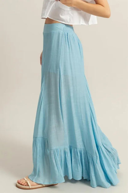 Pastel blue HYFVE high-waist ruffle flared wide-leg pants, stylish and flowy with ruffle details, perfect for a trendy look.