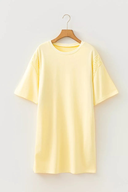 Pastel yellow Trendsi round neck half sleeve T-shirt dress displayed on a hanger, showcasing its casual, comfortable style.