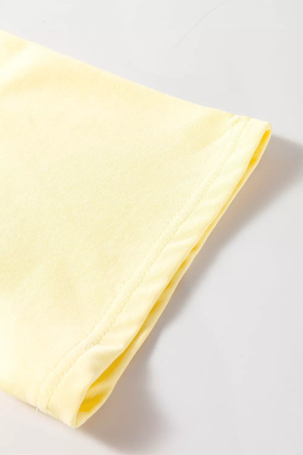 Pastel yellow round neck half sleeve T-shirt dress by Trendsi, casual and comfortable for everyday wear.
