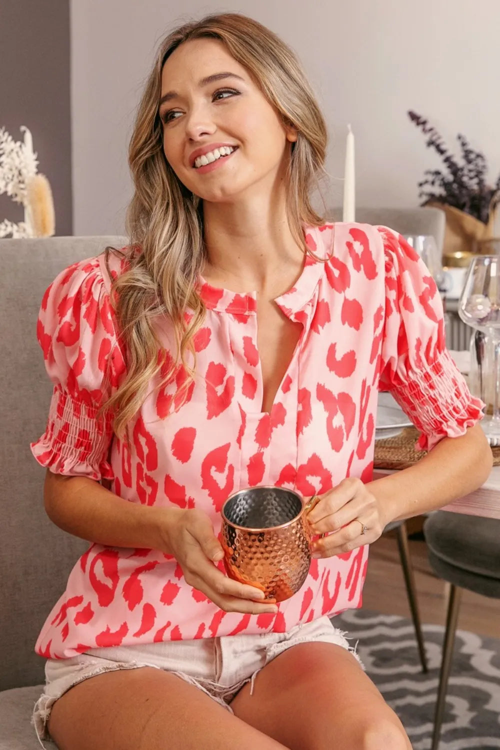 Peach coral BiBi Leopard smocked short sleeve blouse by Trendsi, featuring a relaxed fit with leopard print and smocked details.