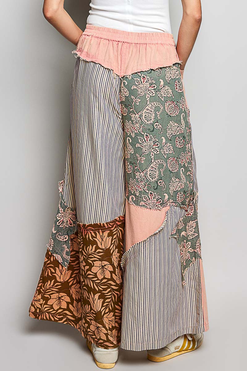 Polished Trendsi women's wide-leg pants with colorful floral patchwork, striped pattern, and bold star patch on side.