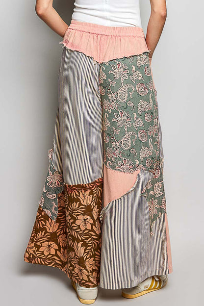 Polished Trendsi women's wide-leg pants with colorful floral patchwork, striped pattern, and bold star patch on side.