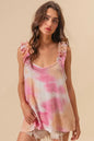 Peach pink BiBi tie-dye printed textured woven fabric with ruffled details, showcasing trendy boho style.