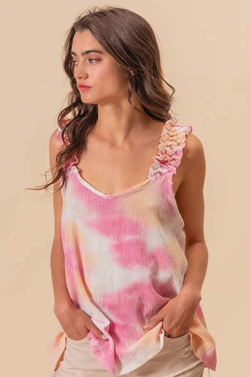 Peach pink BiBi tie-dye printed textured woven fabric with ruffled detail, showcasing a stylish and vibrant design.