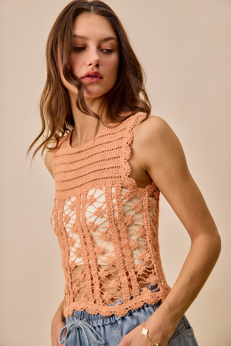 Peach crochet knitted lace sweater tank top from Trendsi, featuring intricate lace detailing and a relaxed fit.