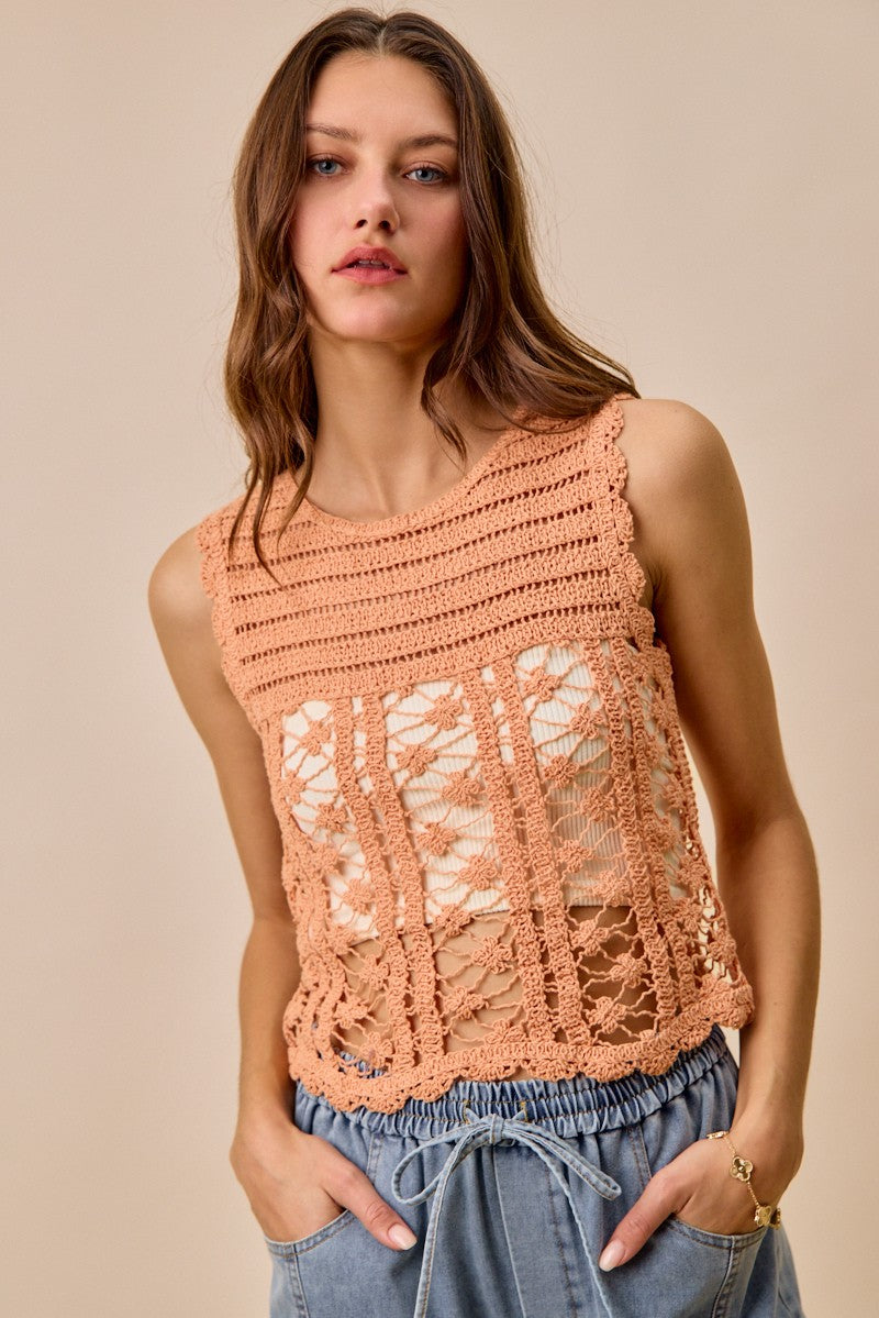 Peach crochet knitted lace sweater tank top from Trendsi, featuring a sleeveless design and delicate lace details.