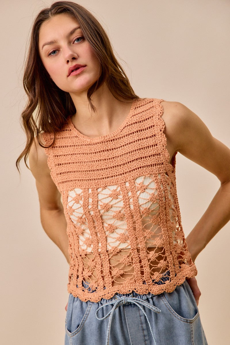 Peach crochet knitted lace sweater tank top by Trendsi, featuring intricate lace details and a sleeveless, relaxed fit.