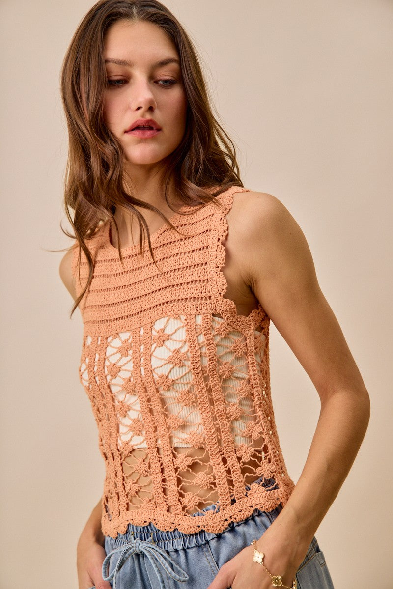 Peach crochet knitted lace sweater tank top by Trendsi, casual sleeveless top with intricate lace details and a relaxed fit.