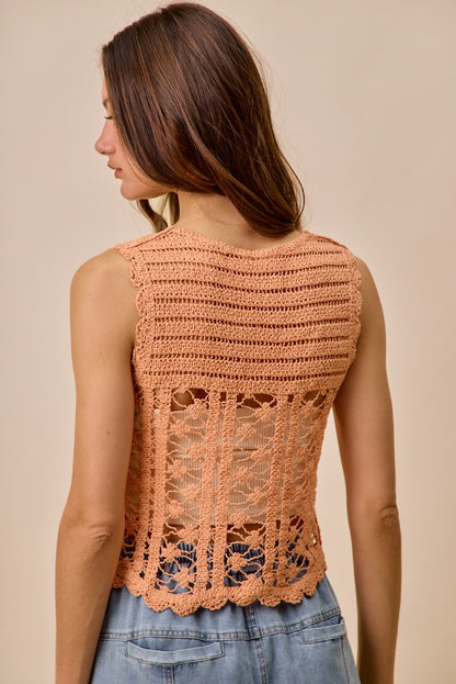 Peach crochet knitted lace sweater tank top by Trendsi, featuring delicate lace detailing and a sleeveless design for a casual look.