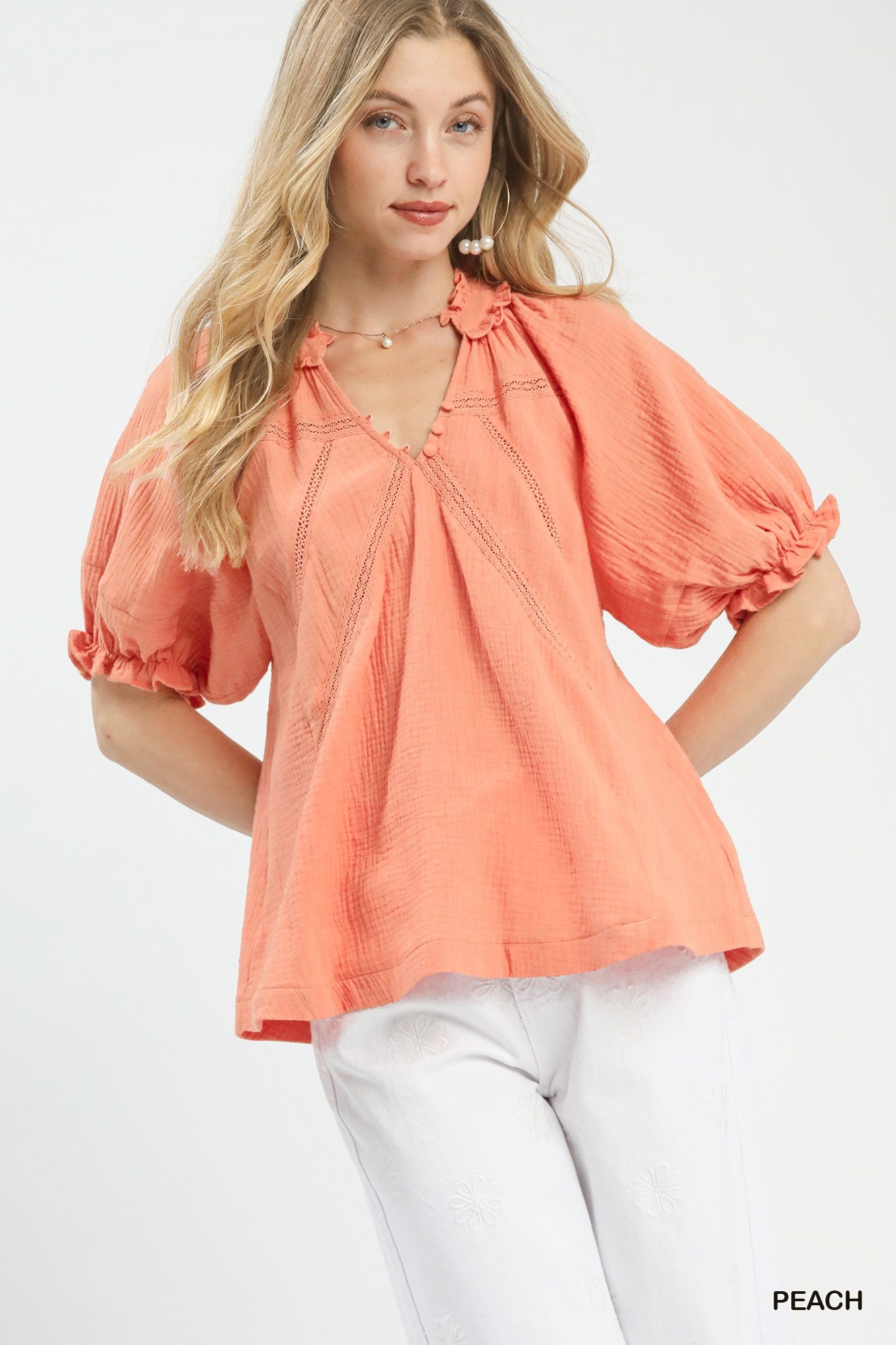 Peach Umgee cotton gauze ruffle top with short sleeves and feminine ruffle details, casual and lightweight for warm weather.