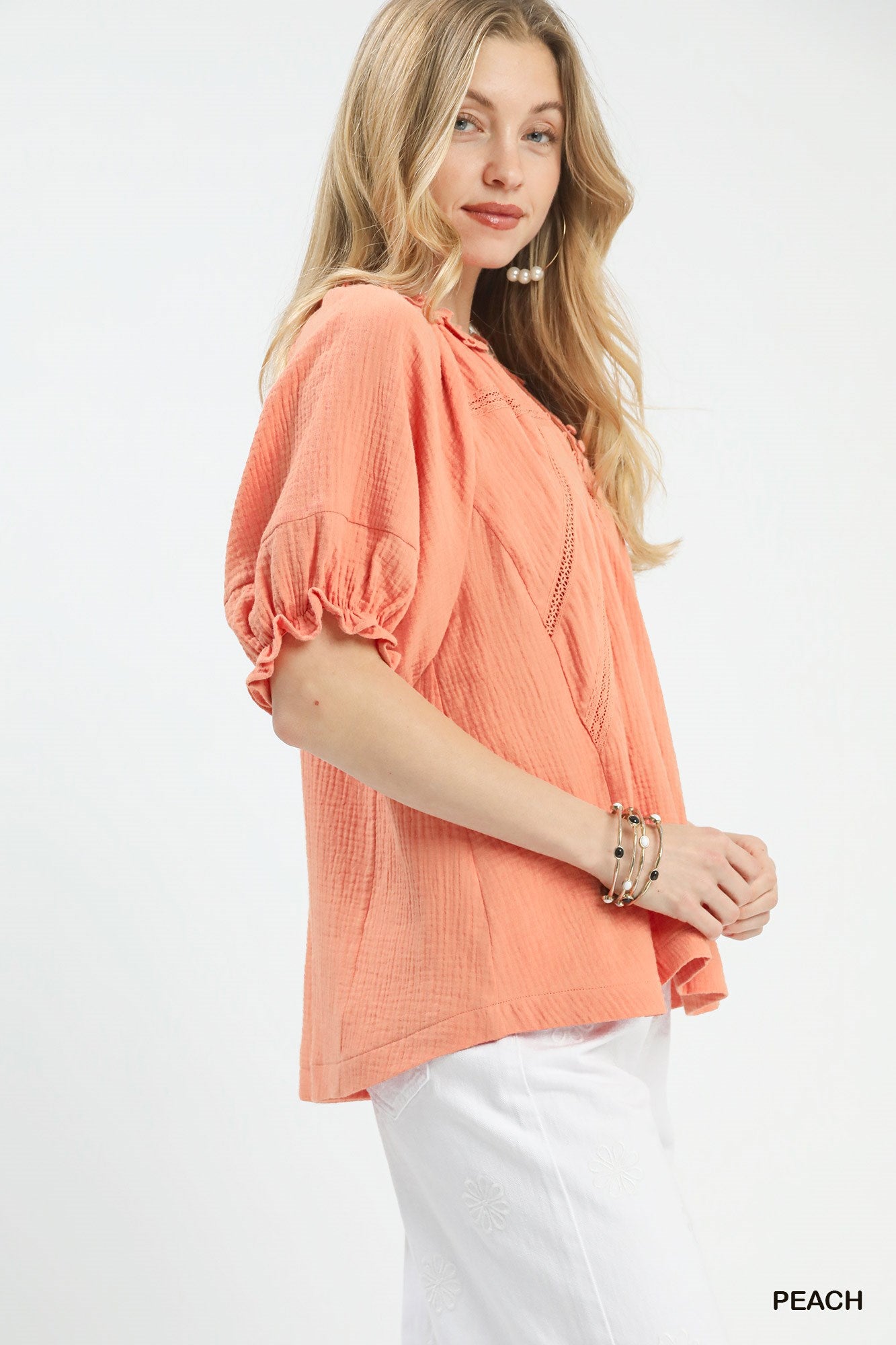 Peach Umgee cotton gauze ruffle top with short sleeves and ruffled accents, casual and lightweight for warm weather.