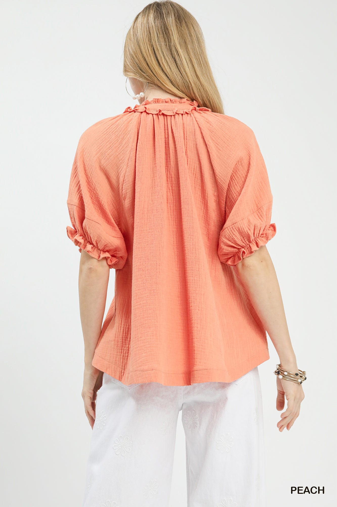 Peach Umgee cotton gauze ruffle top with short sleeves and flowy fit, styled on a mannequin.