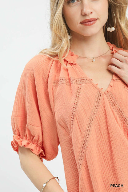 Peach Umgee cotton gauze ruffle top with short sleeves and a relaxed fit, designed by Trendsi.