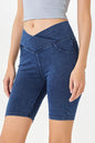 Peacock blue basic Bae asymmetrical waist denim shorts with pockets from Trendsi, featuring a stylish, casual fit and distressed details.