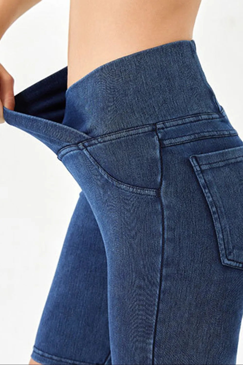 Peacock blue Basic Bae asymmetrical waist denim shorts with front pockets, stylish and casual women's trendy denim shorts.