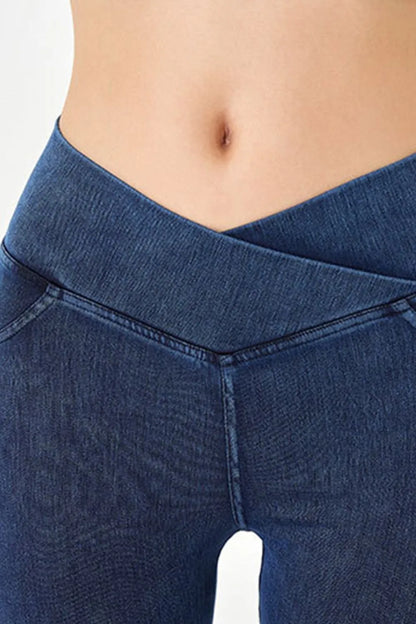 Peacock blue Basic Bae asymmetrical waist denim shorts with front pockets, casual summer fashion by Trendsi.