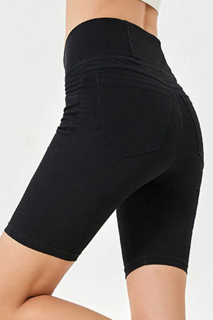 Peacock blue basic Bae asymmetrical waist denim shorts with pockets from Trendsi, casual fit with distressed details.