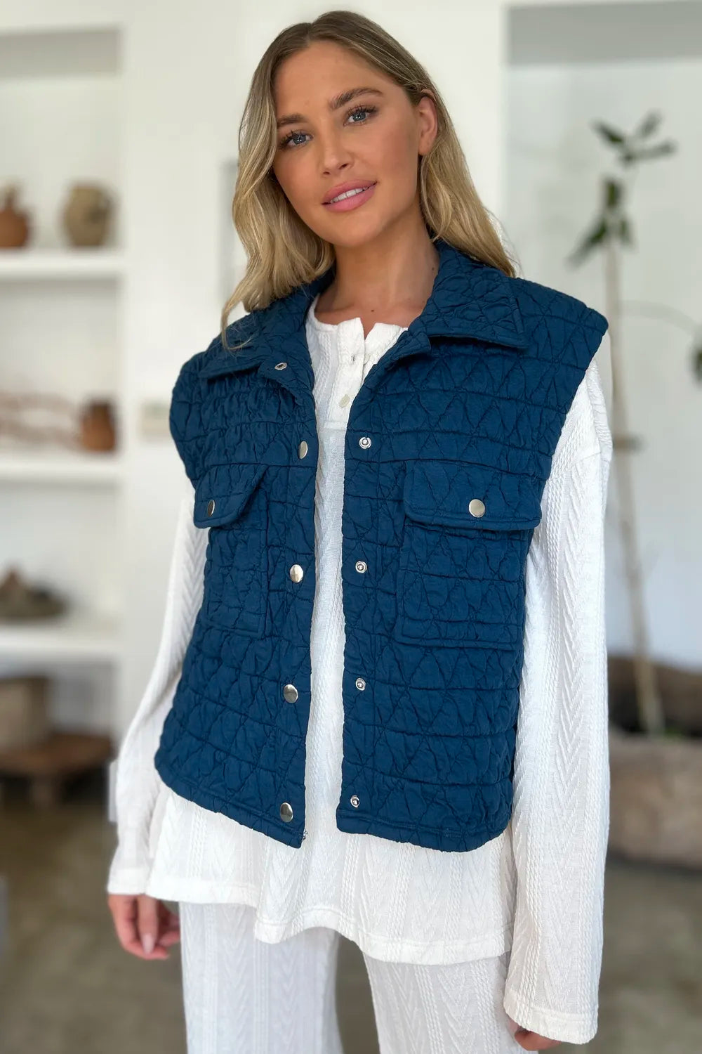 Peacock blue Trendsi Double Take full-size pocketed textured snap-down vest coat laid flat, showing front details and collar.
