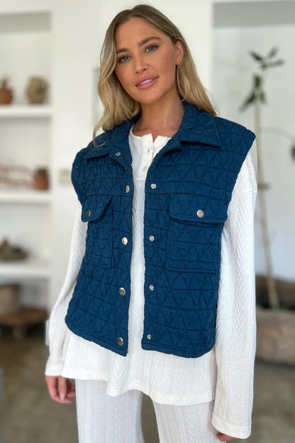 Peacock blue Trendsi Double Take full-size pocketed textured snap-down vest coat laid flat, showing front details and collar.