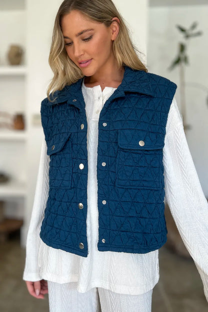 Peacock blue Trendsi Double Take full-size pocketed texture snap-down vest coat shown on model.