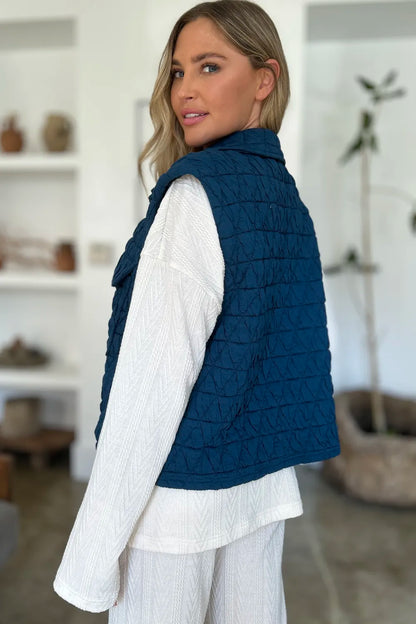 Peacock blue Trendsi Double Take full-size pocketed texture snap-down vest coat, featuring a stylish collar and front pockets.