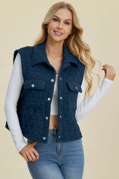 Peacock blue Trendsi Double Take full-size pocketed texture snap-down vest coat displayed on a hanger.