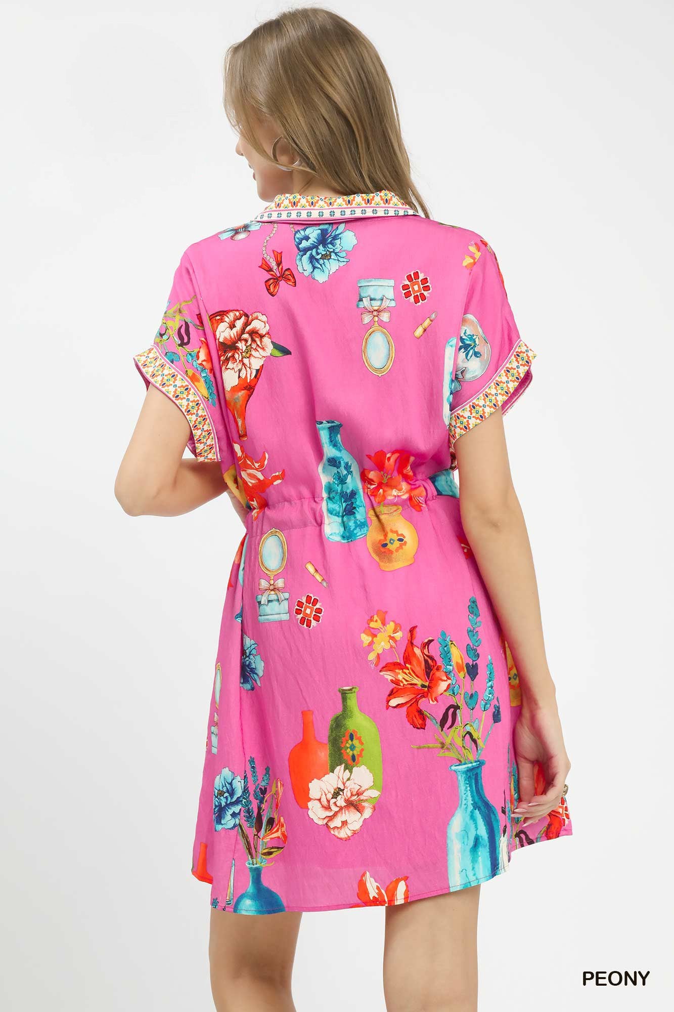 Umgee floral print mini dress with belt, featuring a vibrant floral pattern and waist tie, perfect for casual or summer wear.