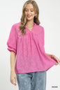Textured lace trim boho blouse by Umgee featuring a V-neck and relaxed fit, styled with long sleeves and a casual, trendy look.