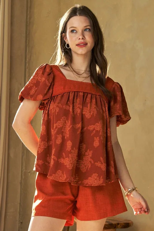 Davi & Dani Nature printed square neck puff sleeve blouse in persimmon color, featuring floral design and lightweight fabric.