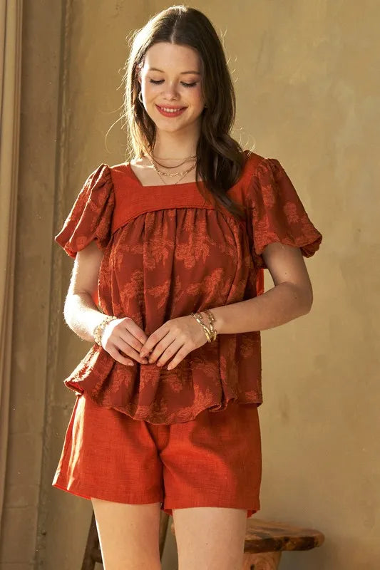 Davi & Dani nature printed square neck puff sleeve blouse in persimmon color, featuring floral design and stylish long sleeves.