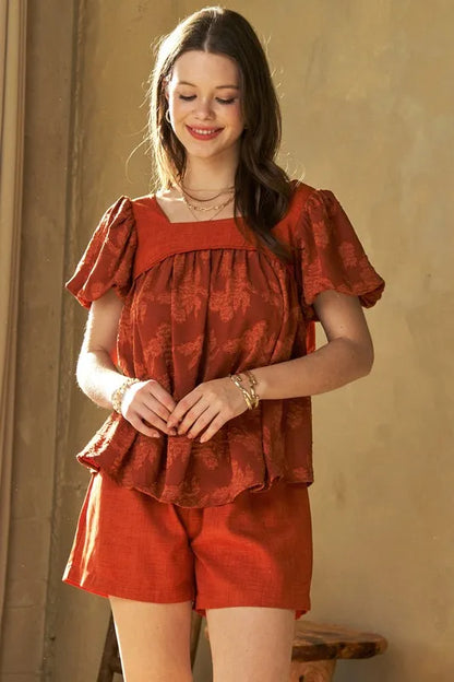 Davi & Dani nature printed square neck puff sleeve blouse in persimmon color, featuring floral design and stylish long sleeves.