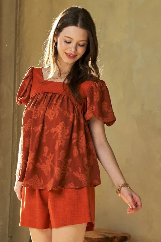Davi & Dani Nature printed square neck puff sleeve blouse in orange with floral pattern, displayed on a white background.