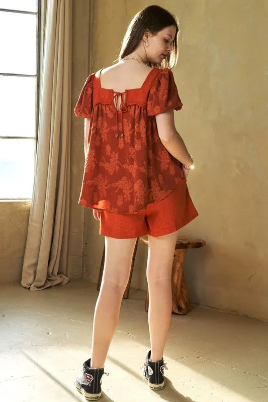 Davi & Dani Nature printed square neck puff sleeve blouse in persimmon, featuring a stylish square neckline and puffed sleeves.