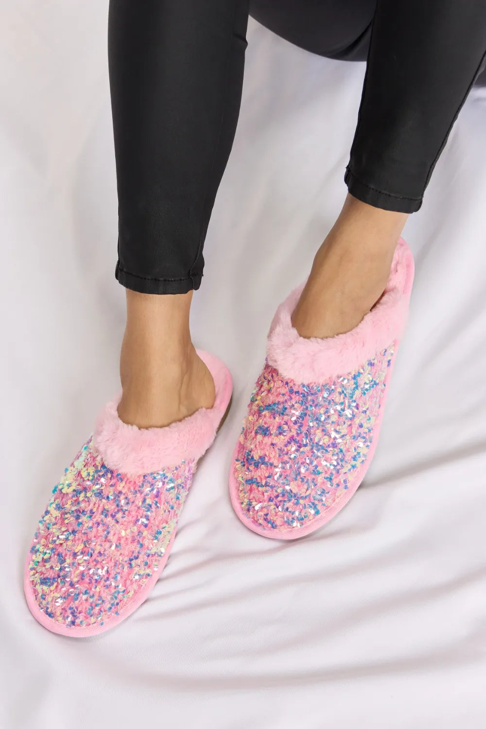 Pink Forever Link sequin plush round toe slippers with soft interior and sparkling sequin details, perfect for cozy comfort.