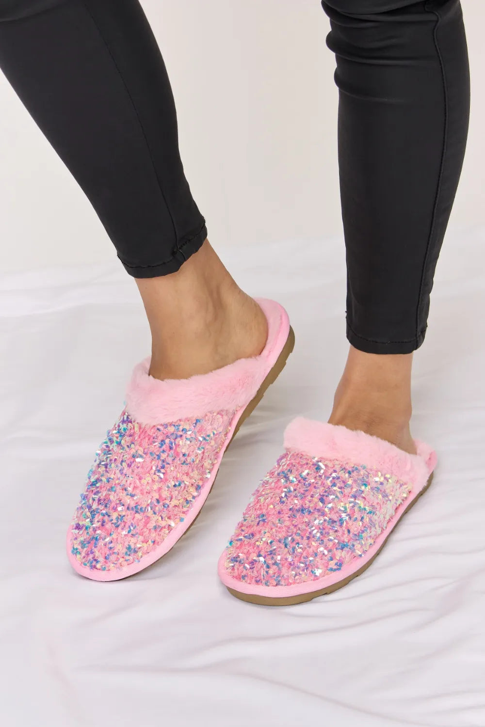 Pink Forever Link Sequin Plush Round Toe Slippers with cushioned soles and soft plush material for cozy comfort.
