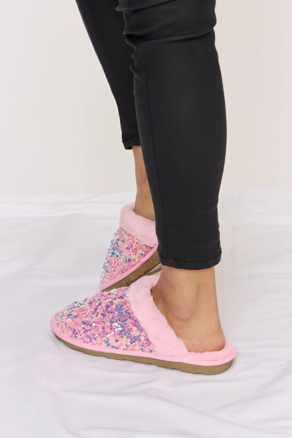 Pink Forever Link Sequin Plush Round Toe Slippers by Trendsi with soft plush material and sparkling sequin details.