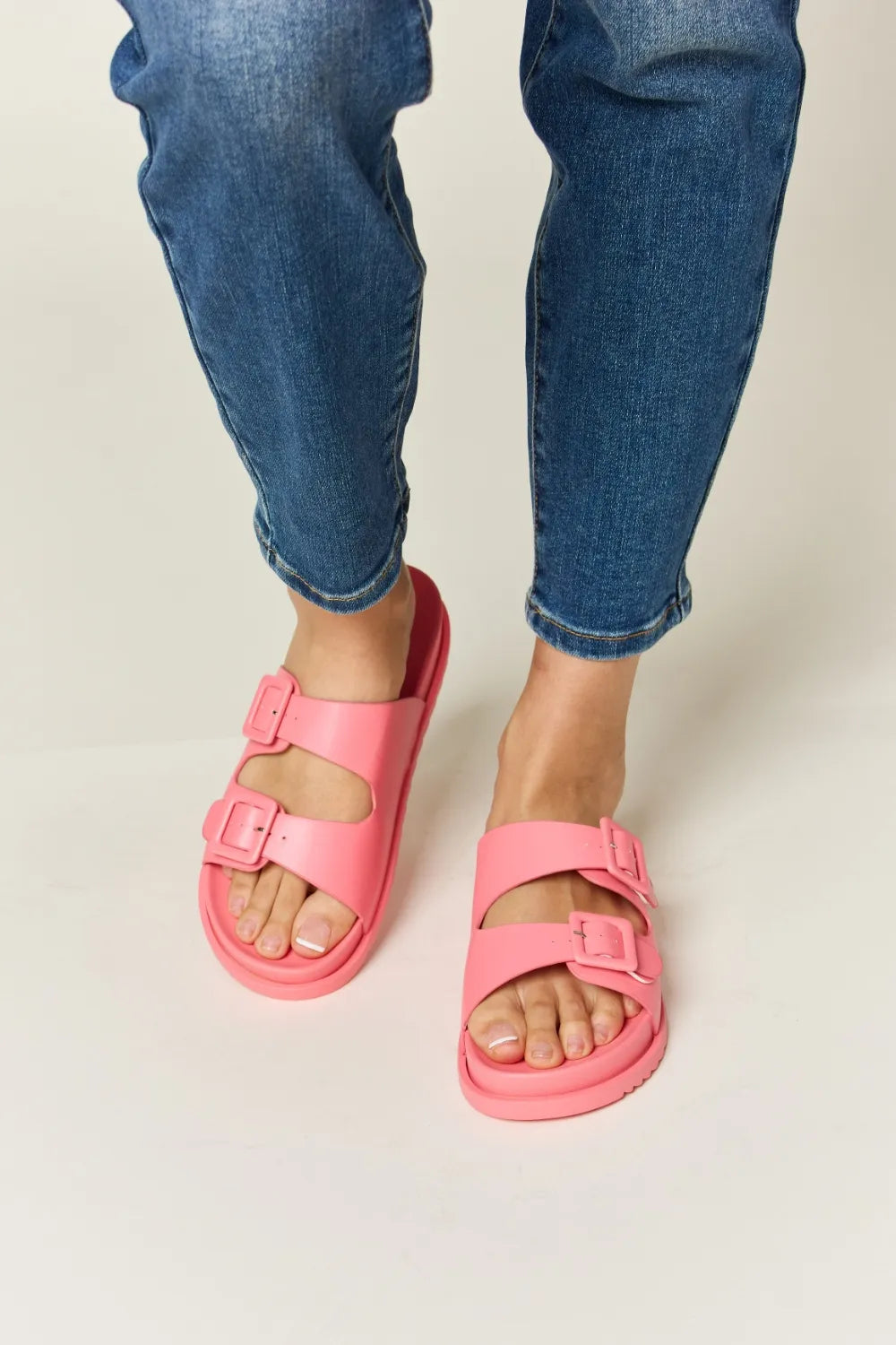 Pink Legend Double Buckle Open Toe Sandals by Trendsi featuring two buckle straps and a stylish open toe design.