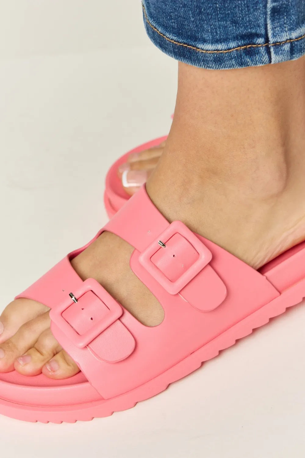 Pink Legend Double Buckle Open Toe Sandals by Trendsi featuring double straps and open toe design.