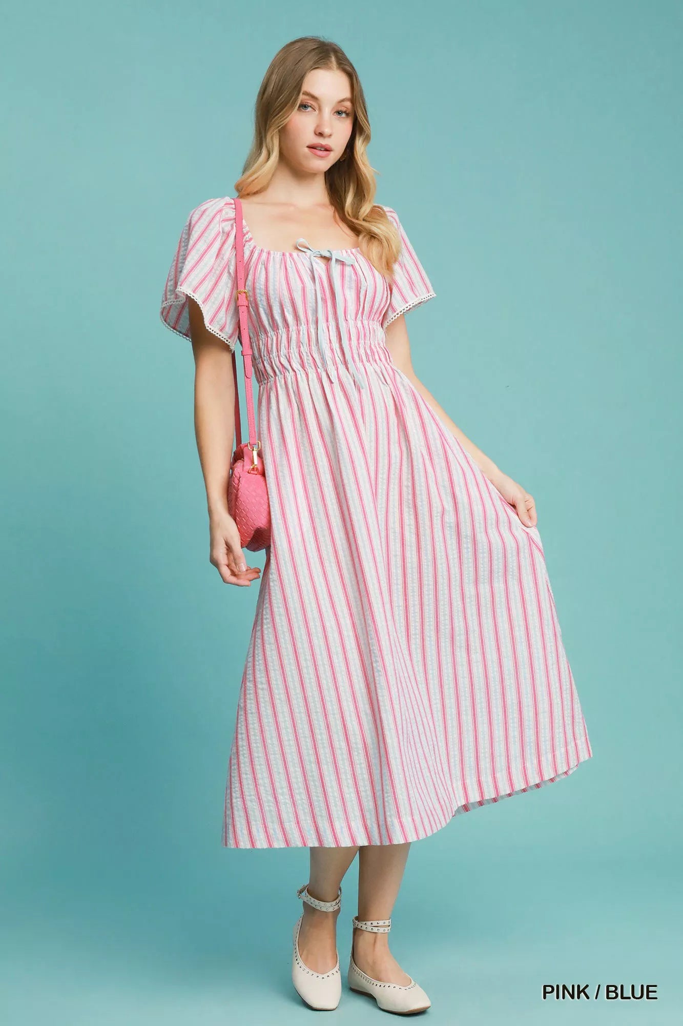 Pink and blue striped Umgee smocked short sleeve midi dress with a relaxed fit, perfect for casual summer wear.