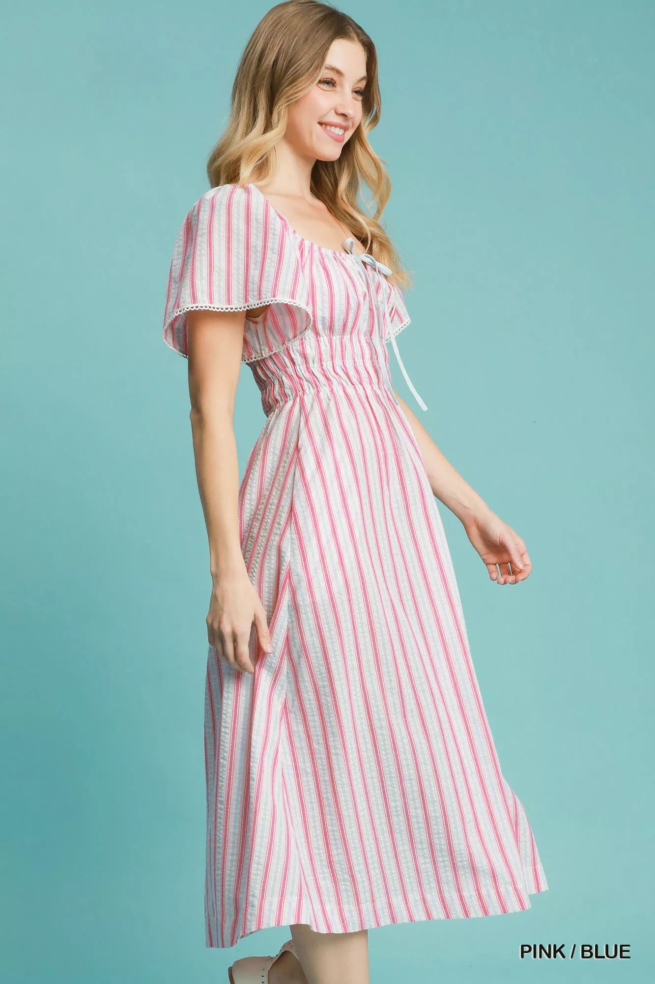 Pink and blue striped Umgee smocked short sleeve midi dress with a relaxed fit and casual style.