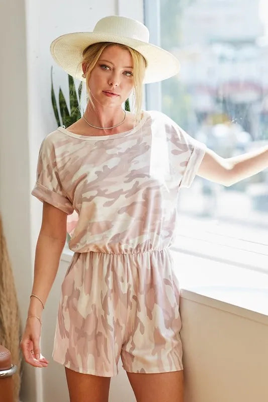Pink camo print French terry romper with side pockets by BiBi, featuring a relaxed fit and casual style.
