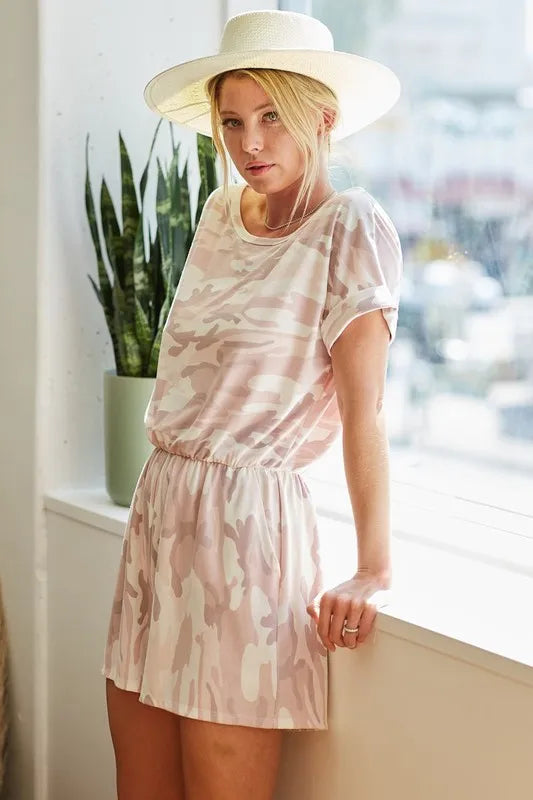 Pink camo print French terry romper by Trendsi with side pockets, featuring a casual, comfortable design perfect for everyday wear.