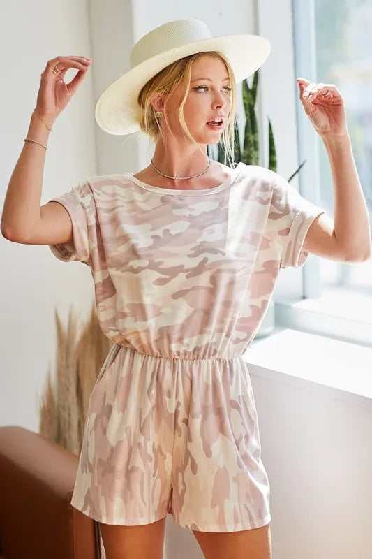 Pink camo print French Terry romper by Trendsi with side pockets and relaxed fit, perfect for casual wear.