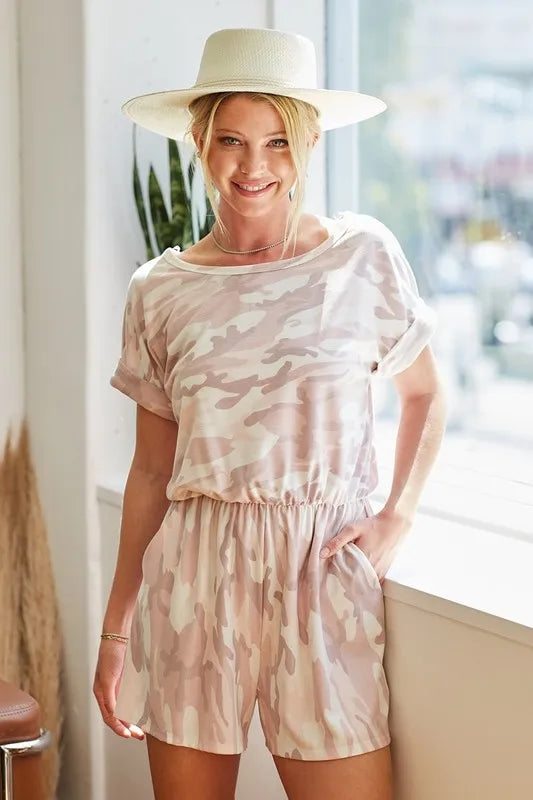 Pink camo print French terry romper with side pockets from Trendsi, featuring a relaxed fit and casual style.