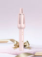 Pink automatic rotating ceramic hair curling iron from Trendsi with European plug, designed for creating smooth, curled hairstyles.