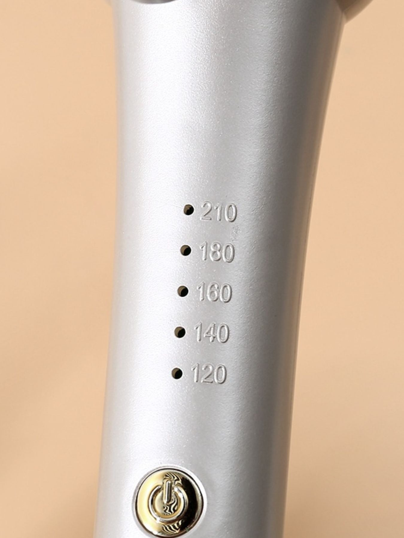 Pink European plug Trendsi fast heating curling iron with a sleek design for smooth, shiny curls.